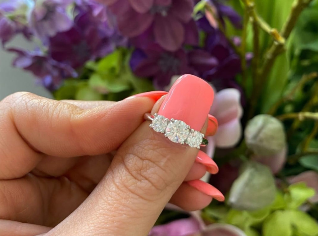 Three stone engagement ring with round brilliant diamonds