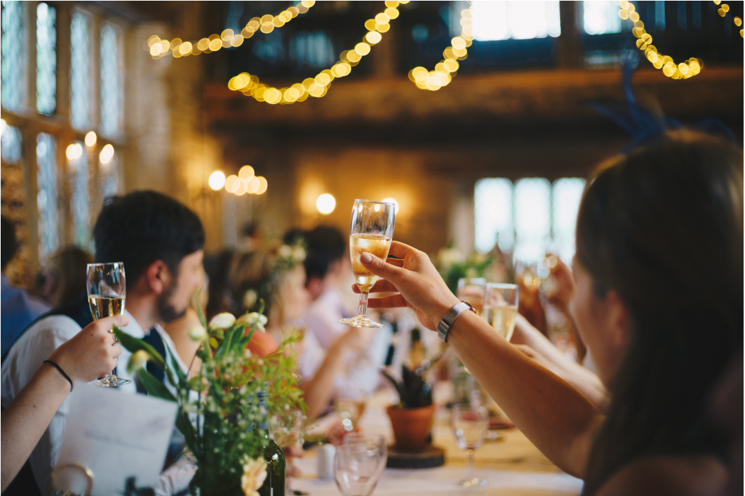 Guests cheers at wedding reception