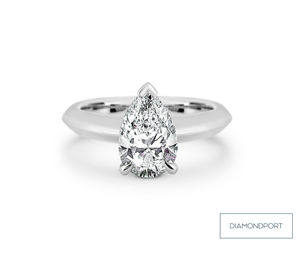 Engagement ring with pear cut diamond set in white gold