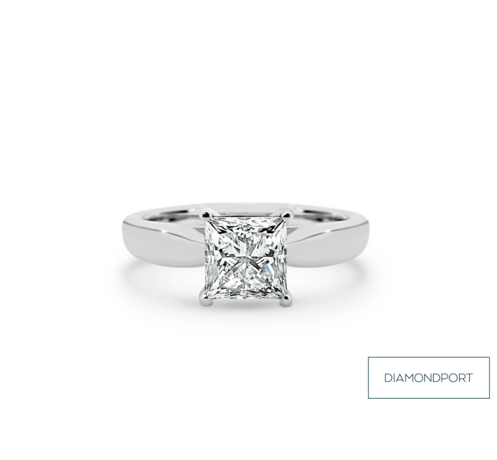 Engagement ring with princess cut diamond set in white gold