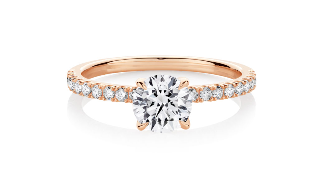 Diamondport rose gold engagement ring with diamonds in the band and in the claws