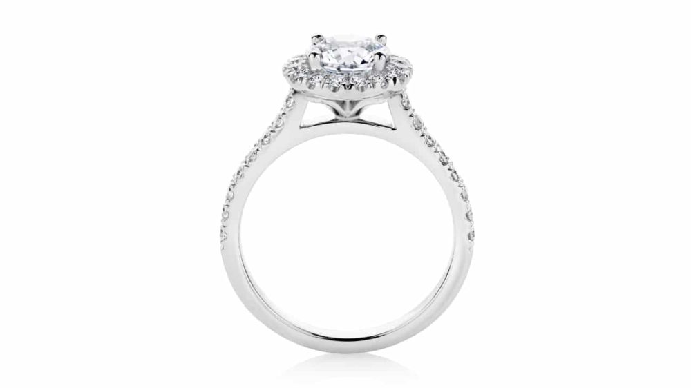 Halo engagement ring with diamonds in the band side view