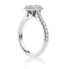 Oval halo engagement ring with diamond band side view