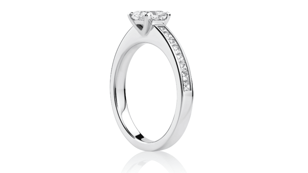 Princess cut diamond engagement ring with diamond band side view
