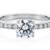 Round brilliant diamond engagement ring with split claw diamond band