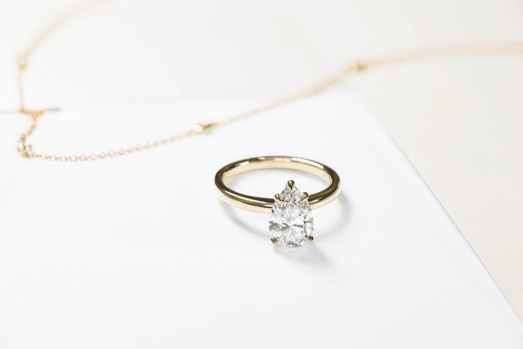 Solitaire-waratah-pear-cut-yellow-gold-diamond-engagement-ring-2