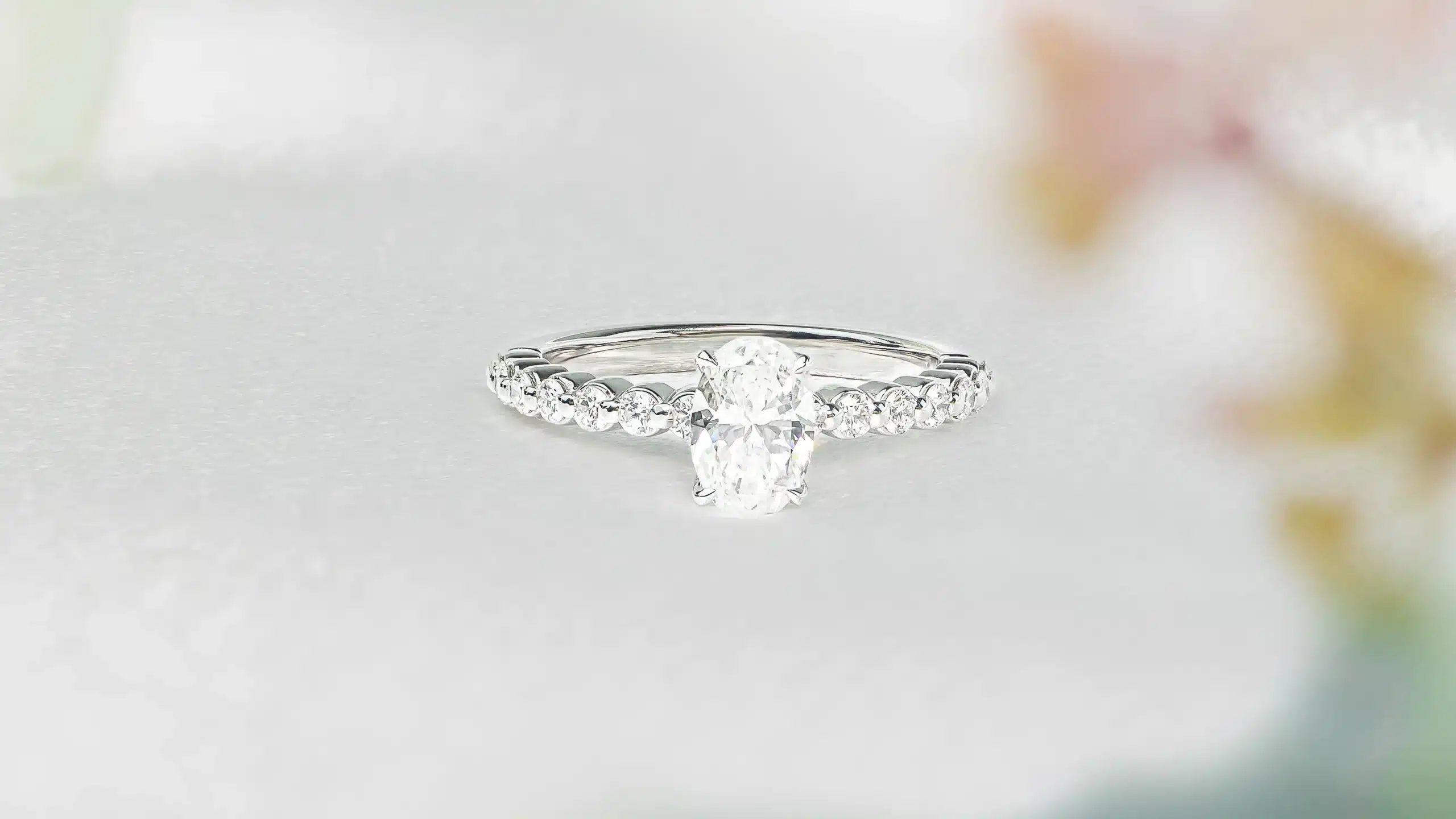 Shared claw oval diamond white gold diamond engagement ring scaled