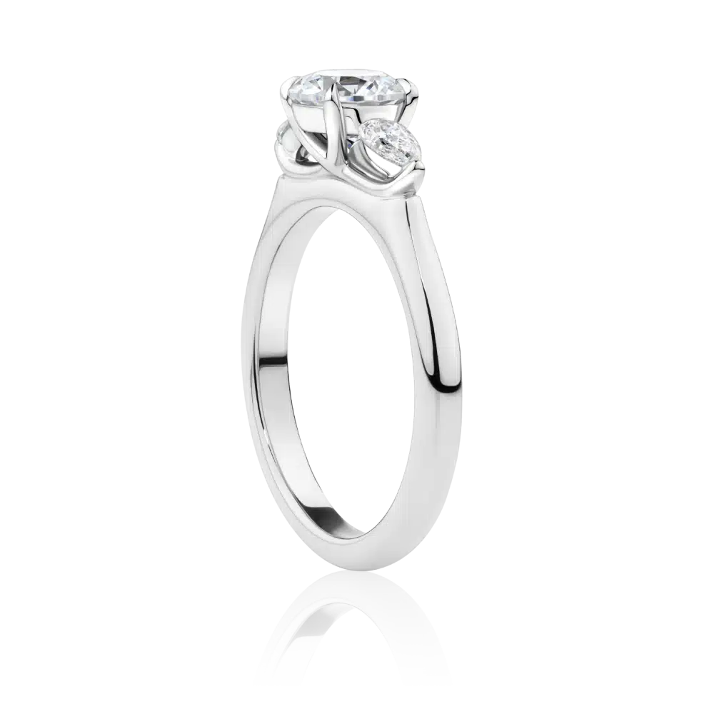 Banksia-side-platinum-round-cut-trilogy-pear-cut-diamond-engagement-ring