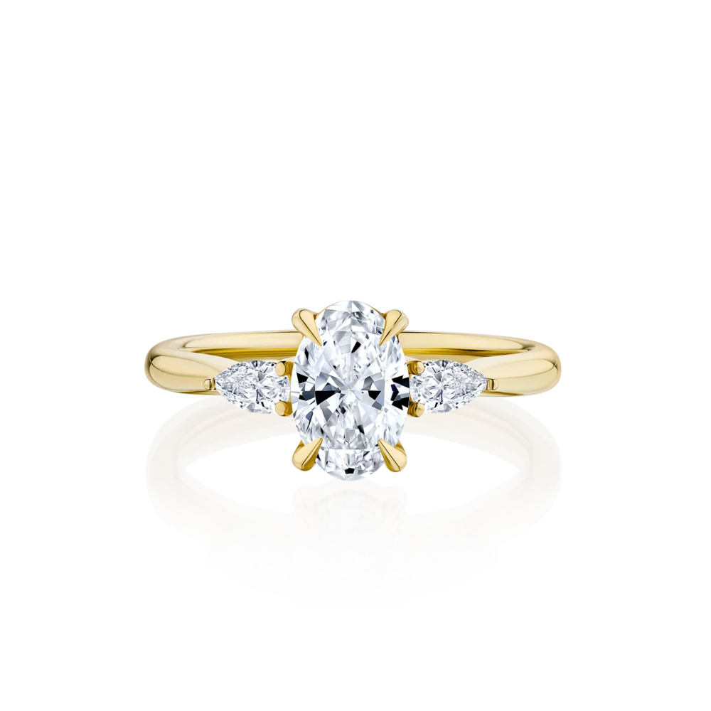 Cyathea-oval-cut-yellow-gold-trilogy-diamond-engagement-ring