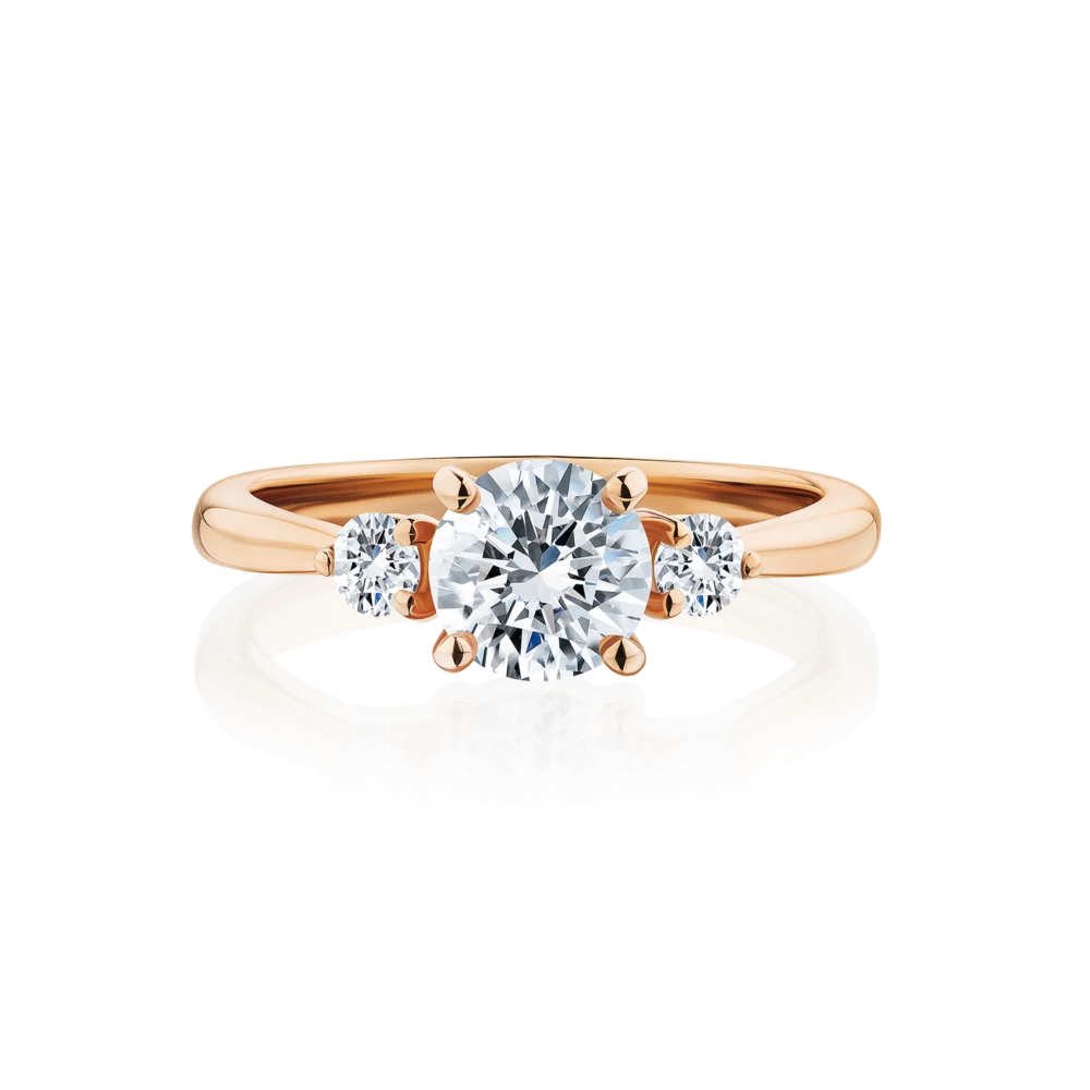Frangipani-round-cut-rose-gold-trilogy-diamond-engagement-ring