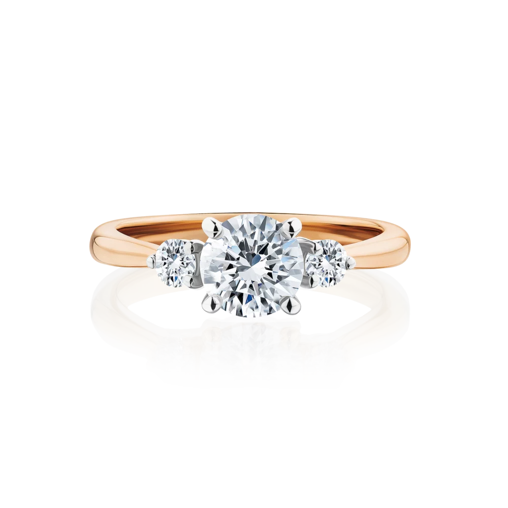 Frangipani-round-cut-rose-gold-two-tone-trilogy-diamond-engagement-ring