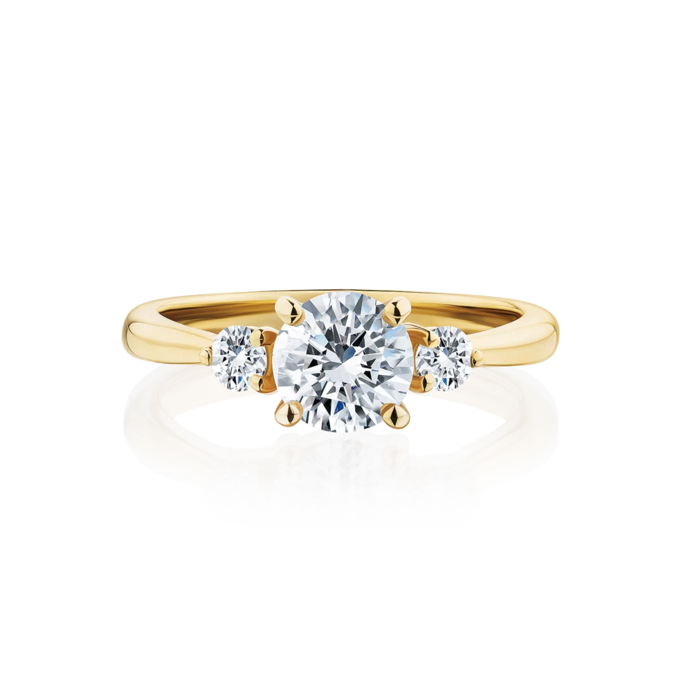 Frangipani-round-cut-yellow-gold-trilogy-diamond-engagement-ring
