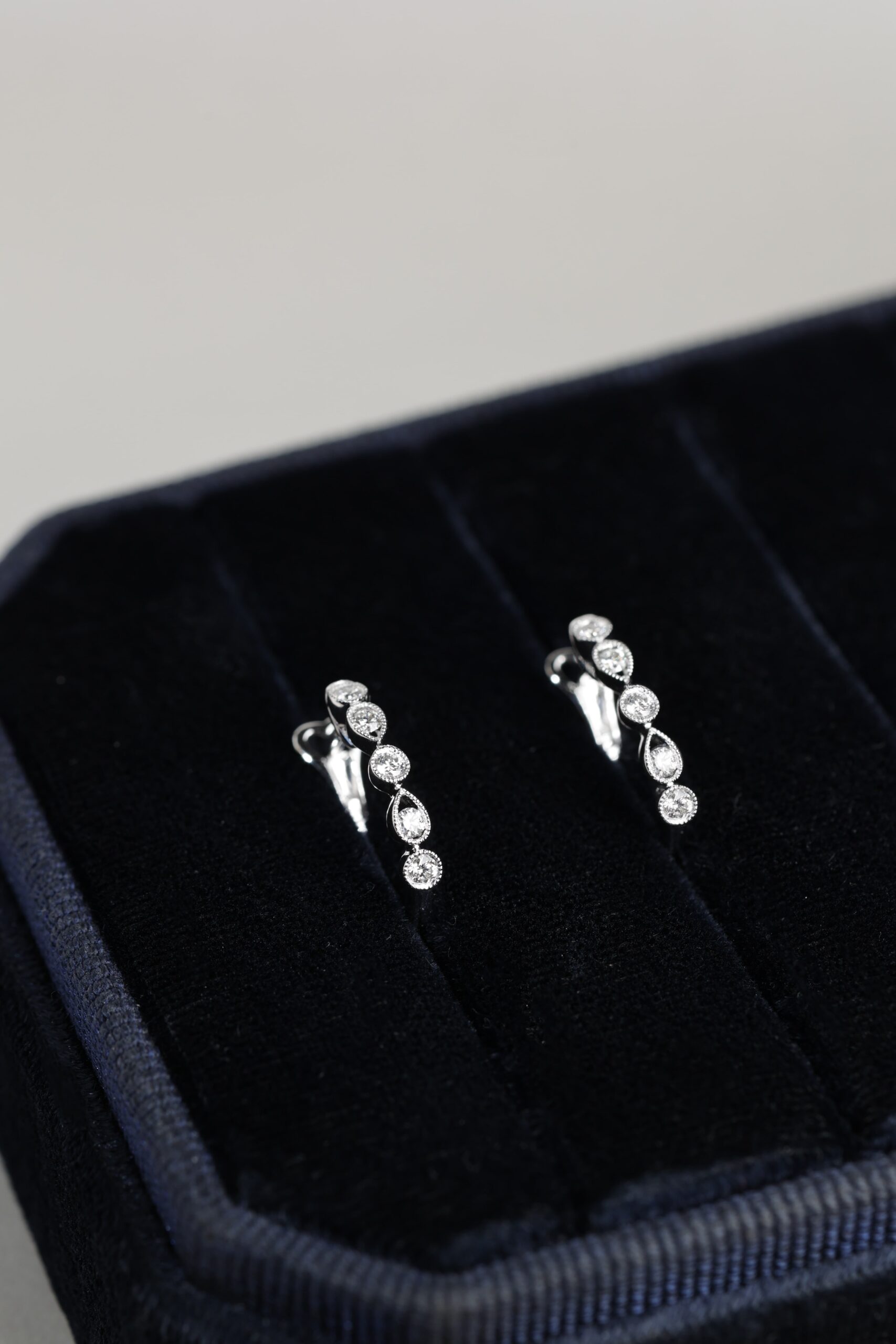 Diamond Round and Pear Milgrain Huggies White Gold