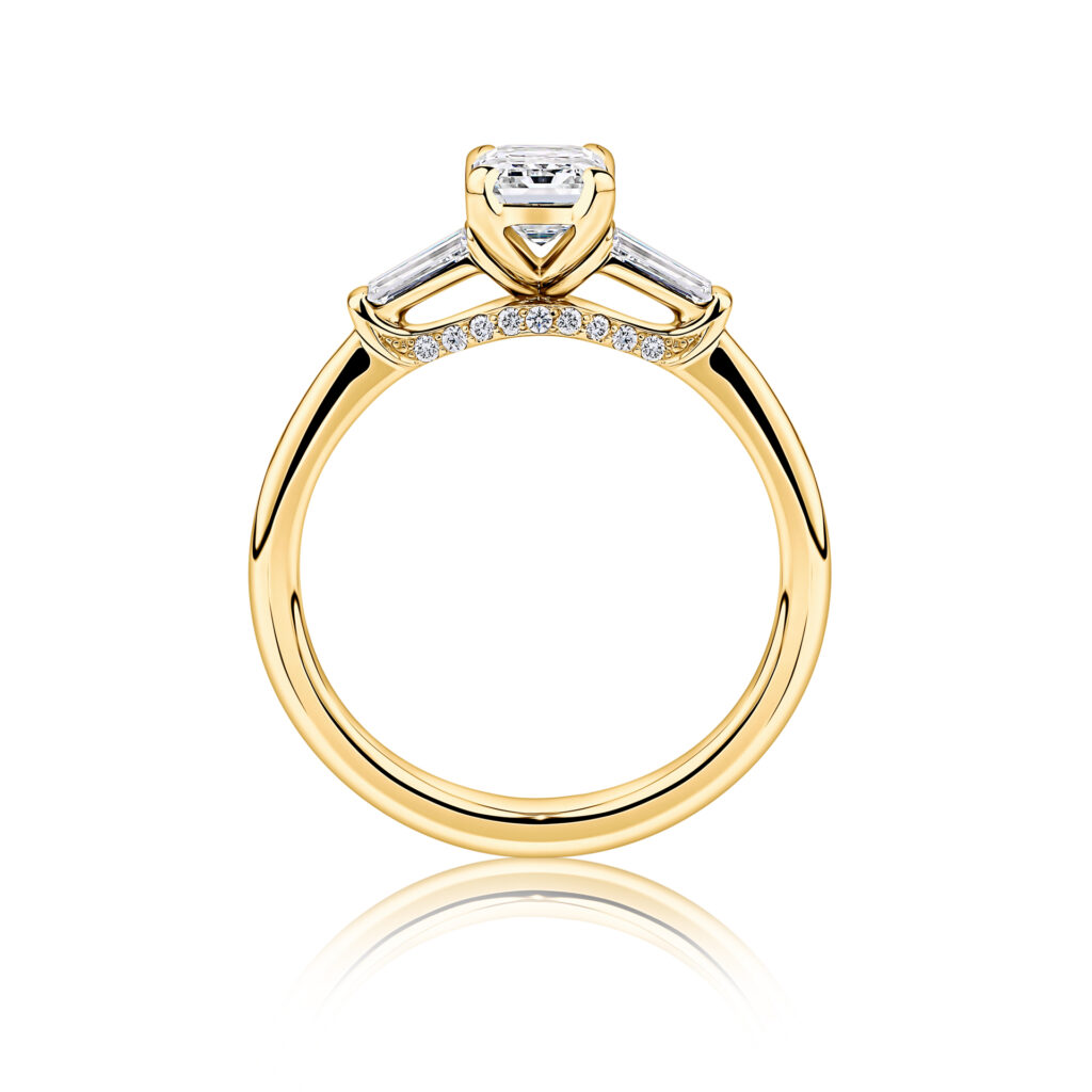 Grevillea-Side-View-Yellow-Gold-Diamond-Bridge-Trilogy-Emerald-Diamond-Engagement-Ring