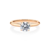 Sundew-side-rose-gold-two-tone-round-diamond-engagement-ring. Webp