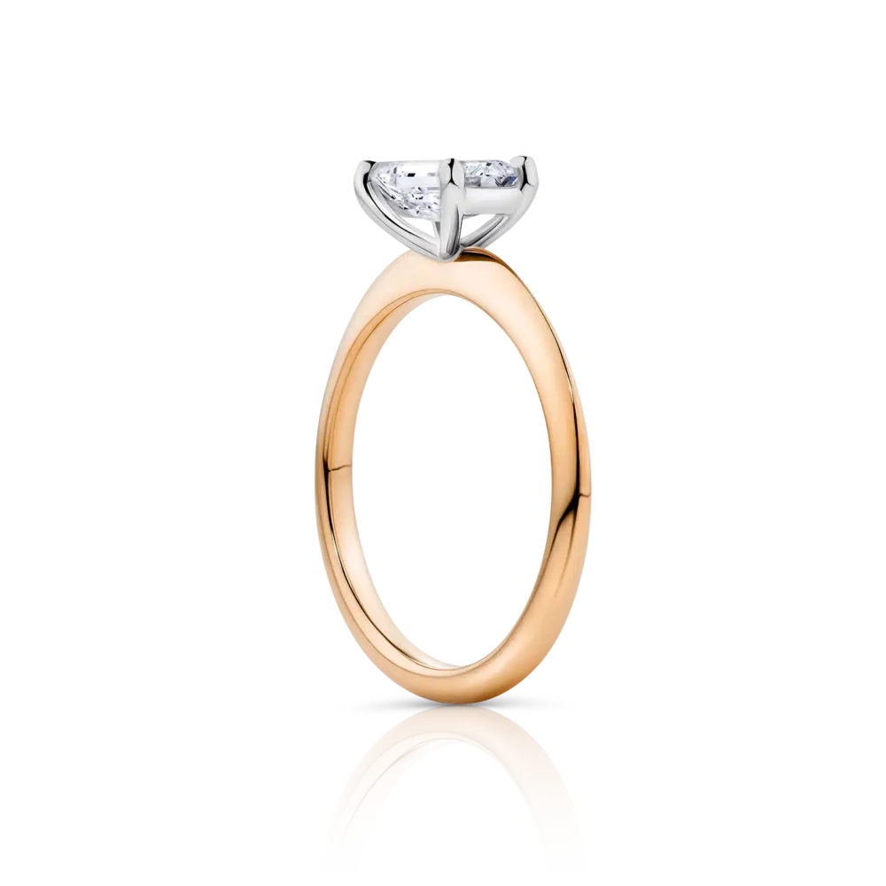 Waratah-emerald-rose-gold-two-tone-side-emerald-diamond-engagement-ring