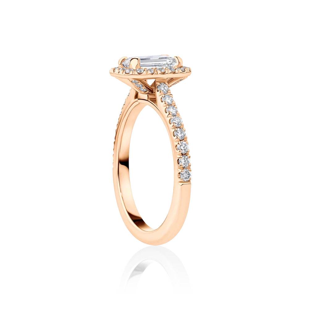 Wattle-emerald-rose-gold-halo-side-emerald-diamond-engagement-ring