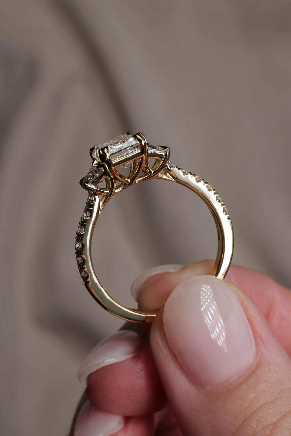Emerald and Trapezoid trilogy ring 1 scaled