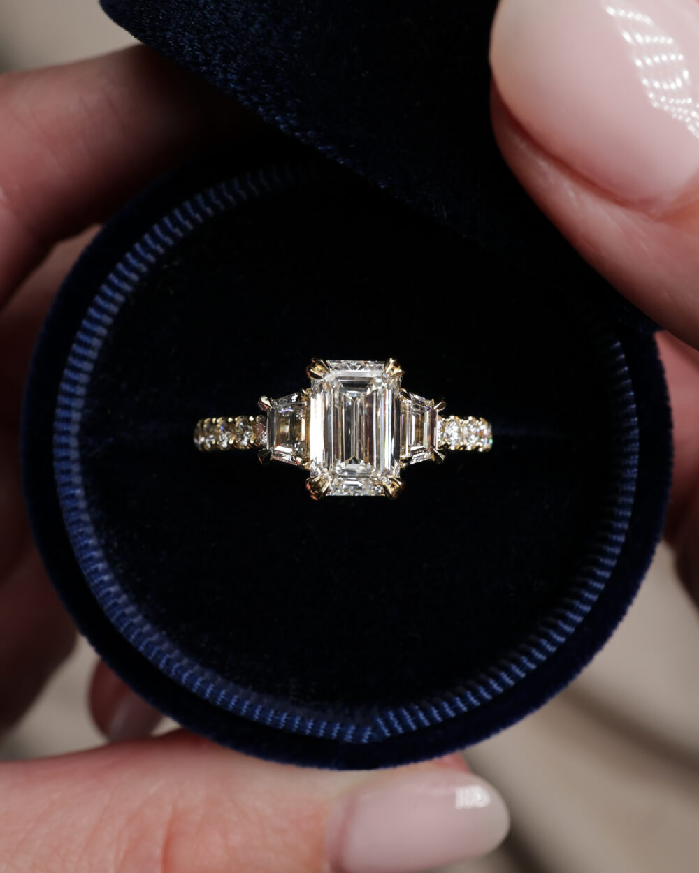 Emerald and Trapezoid trilogy ring 3 scaled