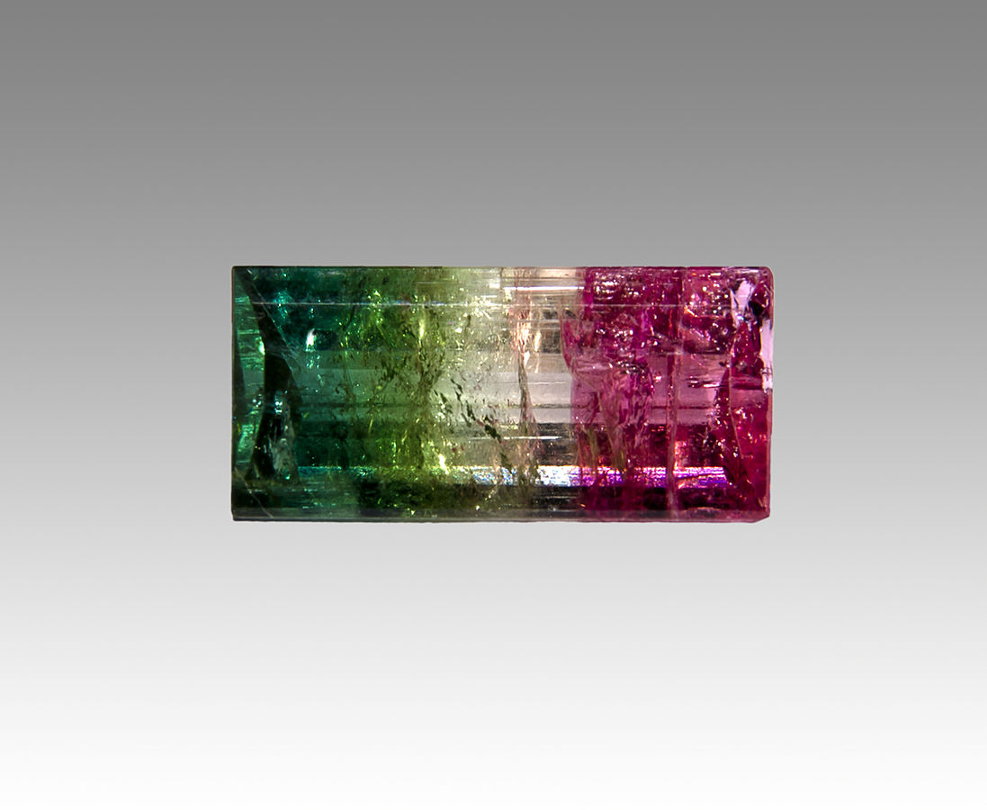 Watermelon tourmaline showing the pink tourmaline centre with the colourless and green tourmaline outer layers
