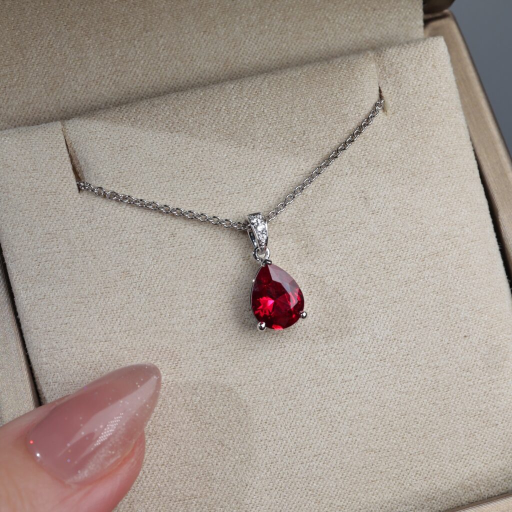 Synthetic Ruby Pendant with Accented Diamond Bail
