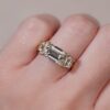 East west emerald cut with trapezoid three stone ring yellow gold 1