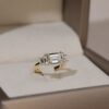 East west emerald cut with trapezoid three stone ring yellow gold 2