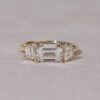 East west emerald cut with trapezoid three stone ring yellow gold 3
