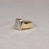 Wide bezel set radiant cut lab diamond ring in yellow gold